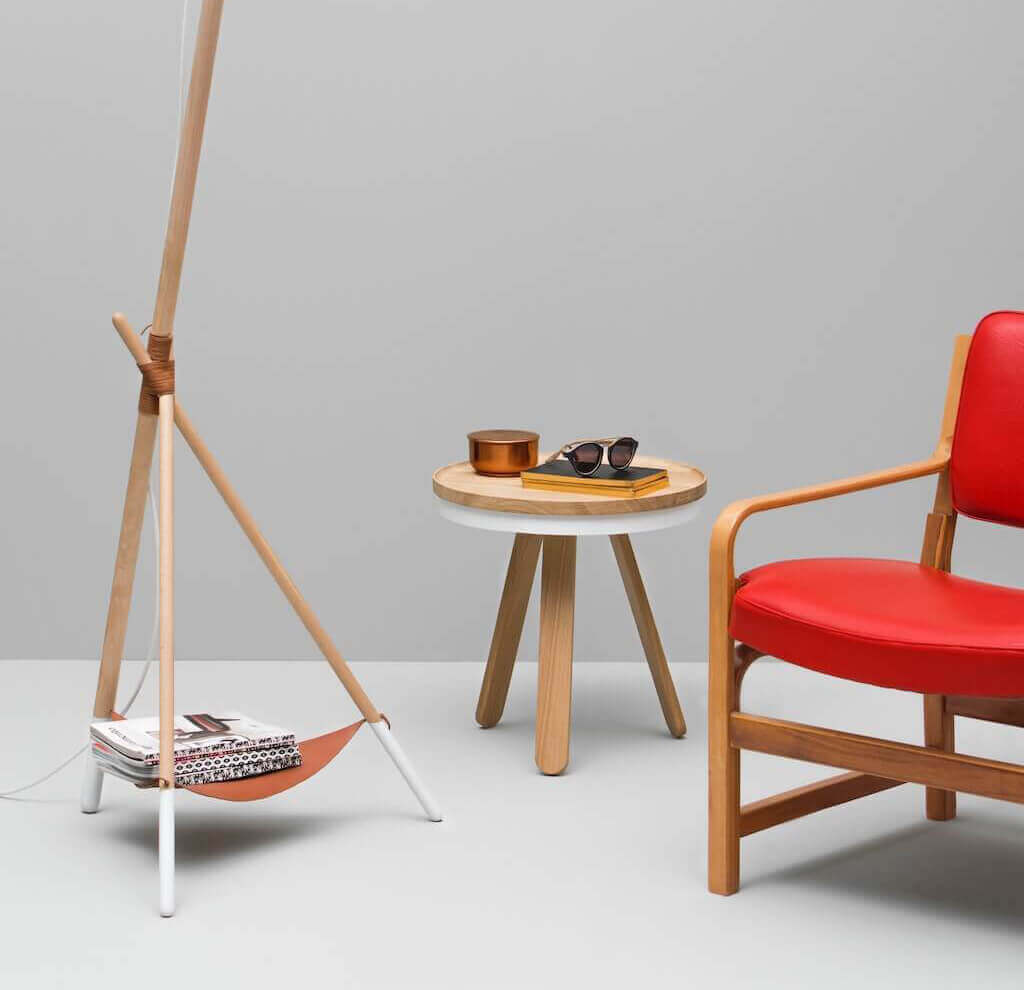 red chair next to an end table